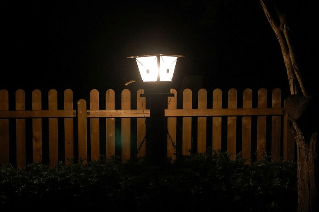 lightpost in a yard at night lit up